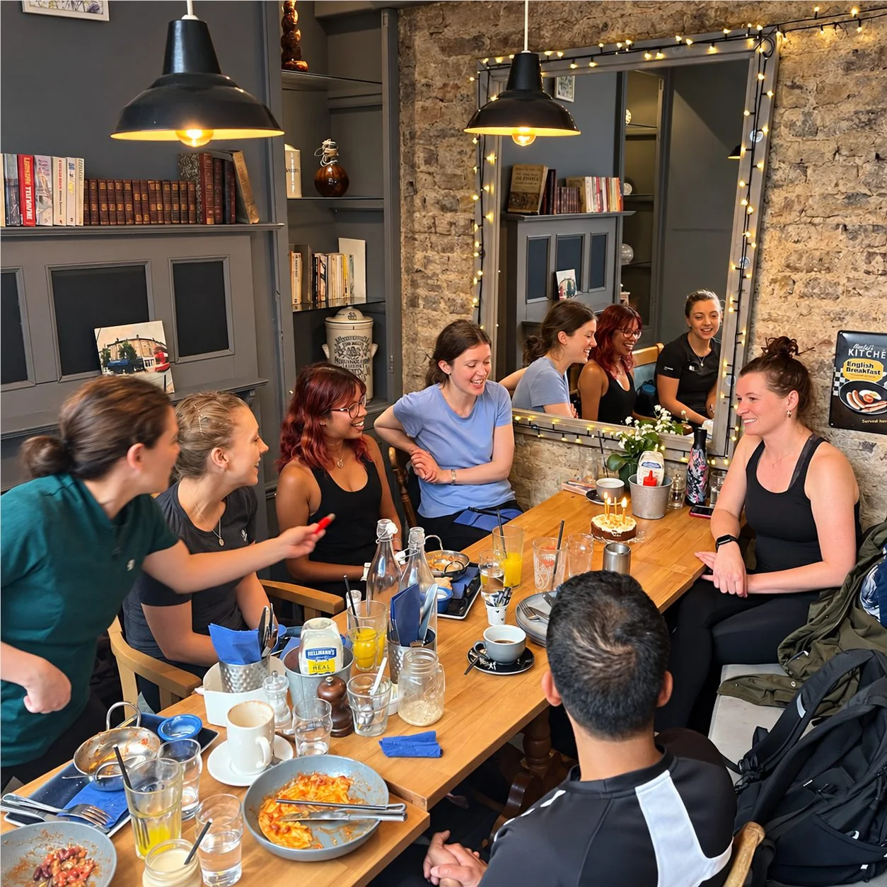 Putney Bootcamp members chatting together around a café table